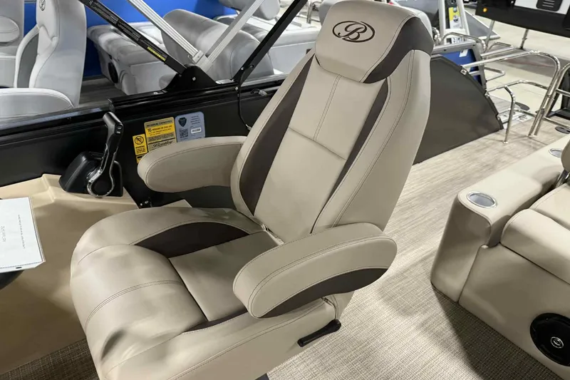 Slide: The Image of 2026 Bentley Pontoons Legacy 243 Swingback captain's chair, beige and brown, luxurious design. - 8