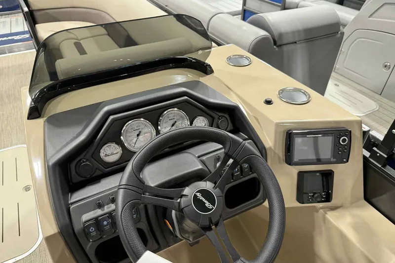 Slide: The Image of 2026 Bentley Pontoons Legacy 243 Swingback dashboard with steering wheel and gauges. - 9