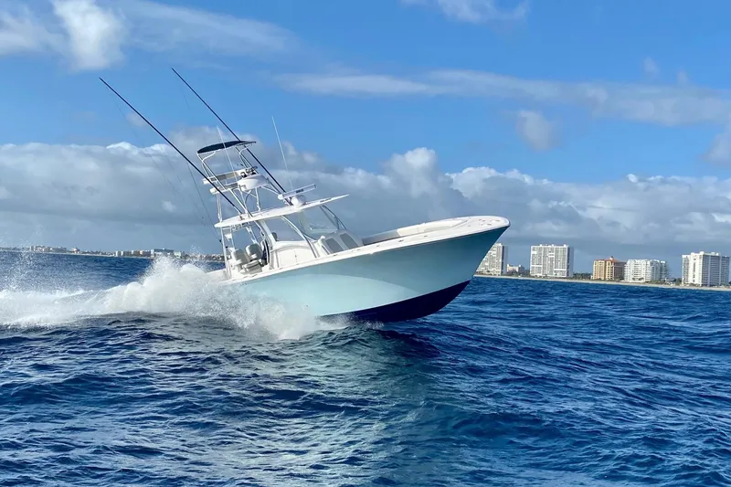 The Image of 2022 Front Runner 39 CC boat cruising on ocean with city skyline in background. - 0