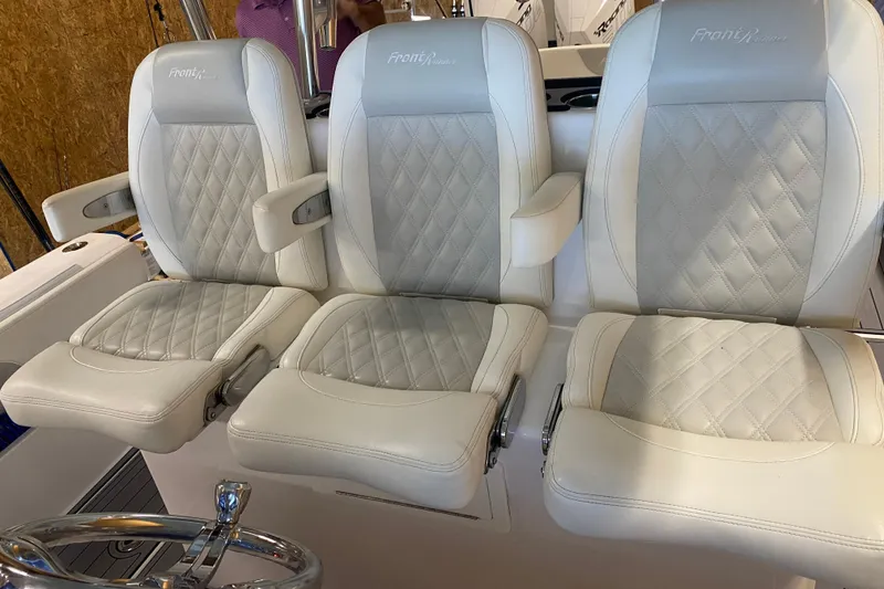 Slide: The Image of 2022 Front Runner 39 CC boat seats with diamond-stitched upholstery and armrests. - 16