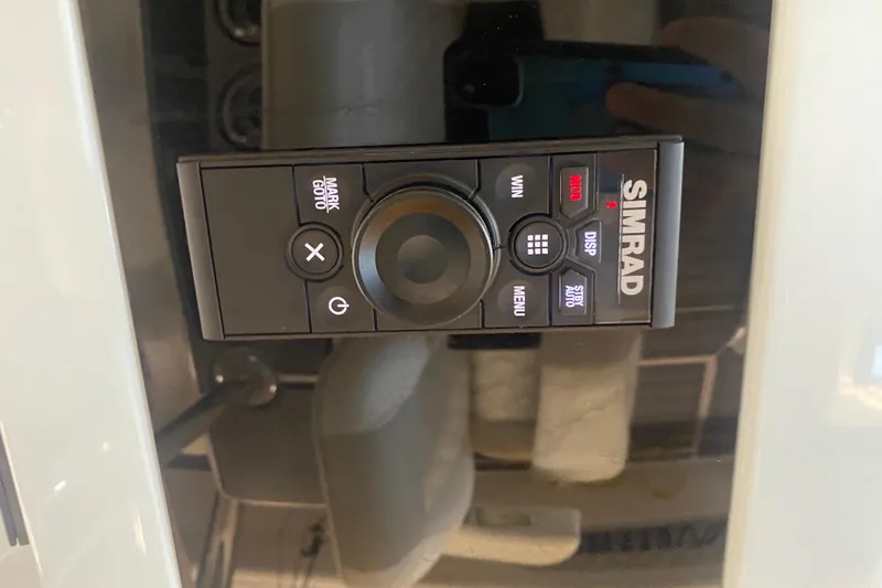 Slide: The Image of Simrad control panel on 2022 Front Runner 39 CC boat dashboard. - 27