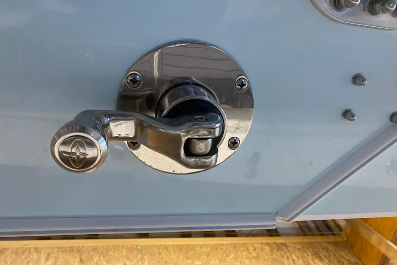 Slide: The Image of Chrome handle on 2022 Front Runner 39 CC boat, close-up view. - 30