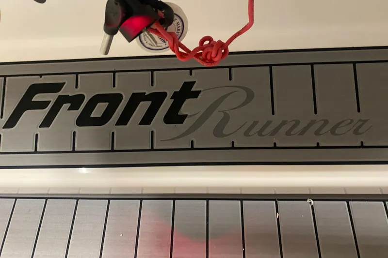 Slide: The Image of 2022 Front Runner 39 CC boat logo with red rope and key. - 32