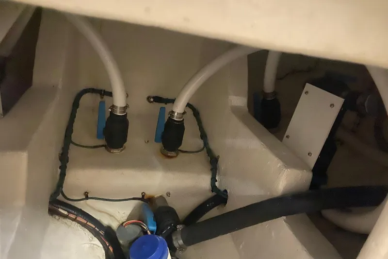 Slide: The Image of Engine compartment of 2022 Front Runner 39 CC boat, showing hoses and fittings. - 33