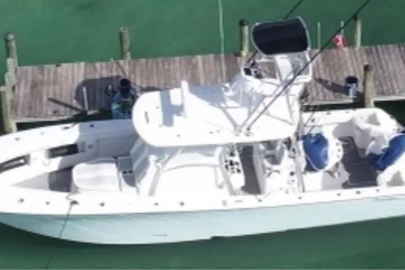 Slide: The Image of 2022 Front Runner 39 CC boat docked on clear water, aerial view. - 4