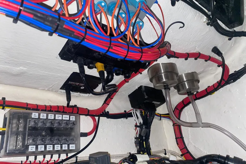 Slide: The Image of Electrical wiring system in a 2022 Front Runner 39 CC boat, showcasing organized cables and components. - 40