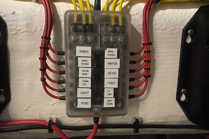 Slide: The Image of Electrical panel with labeled wires in a 2022 Front Runner 39 CC boat. - 42