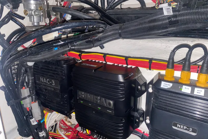 Slide: The Image of Electrical components and wiring inside a 2022 Front Runner 39 CC boat. - 43