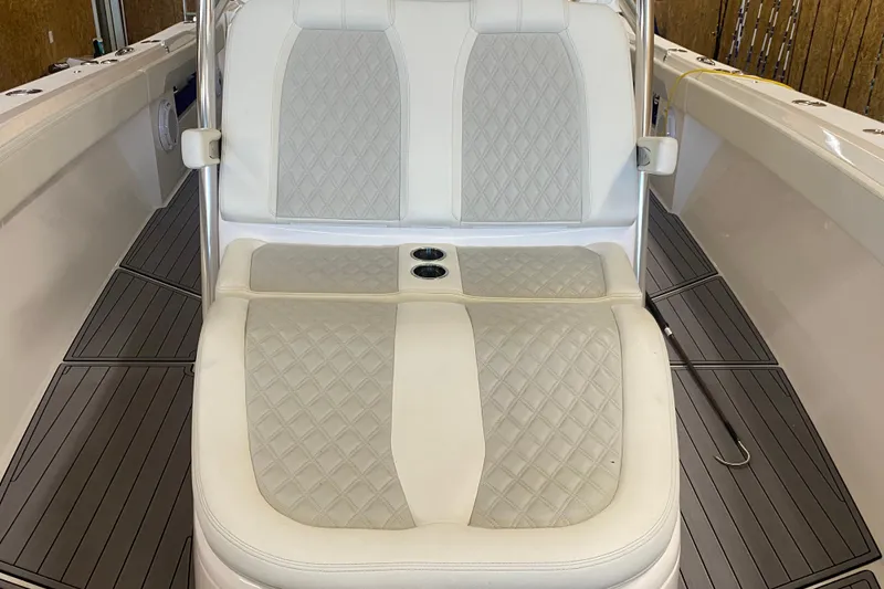 Slide: The Image of 2022 Front Runner 39 CC boat interior with cushioned seating and cup holders. - 46