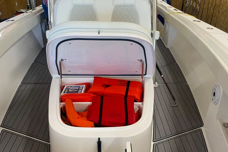 Slide: The Image of 2022 Front Runner 39 CC boat with open storage compartment containing life jackets. - 47