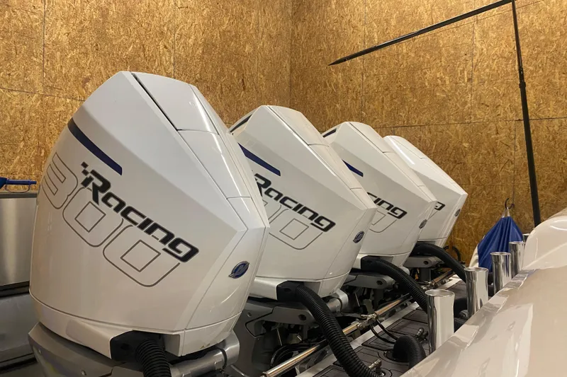 Slide: The Image of Four powerful outboard engines on a 2022 Front Runner 39 CC boat. - 9