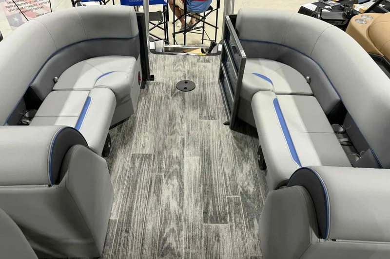 Slide: The Image of 2026 Bentley Pontoons Legacy 223 Navigator interior with gray seating and blue accents. - 12