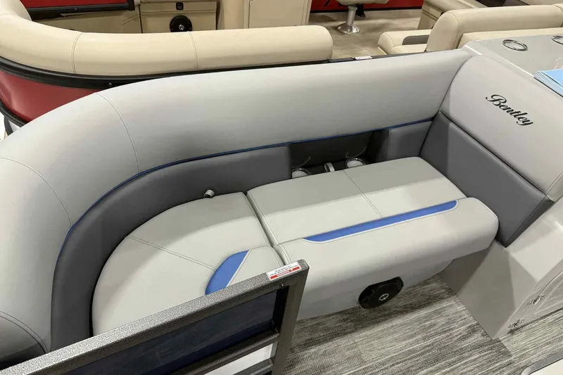 Slide: The Image of 2026 Bentley Pontoons Legacy 223 Navigator Full Tube interior seating, featuring sleek gray upholstery. - 23