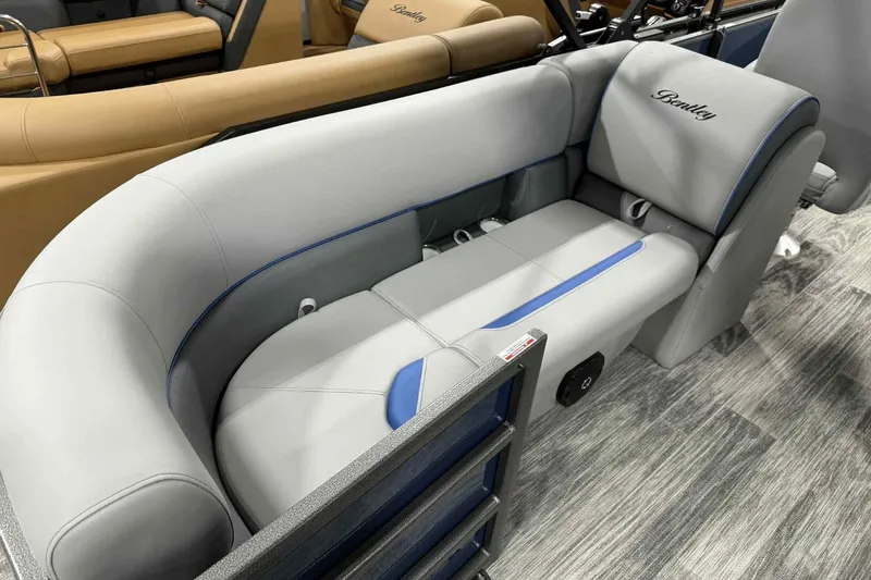 Slide: The Image of 2026 Bentley Pontoons Legacy 223 Navigator Full Tube interior seating, featuring luxurious gray upholstery. - 4