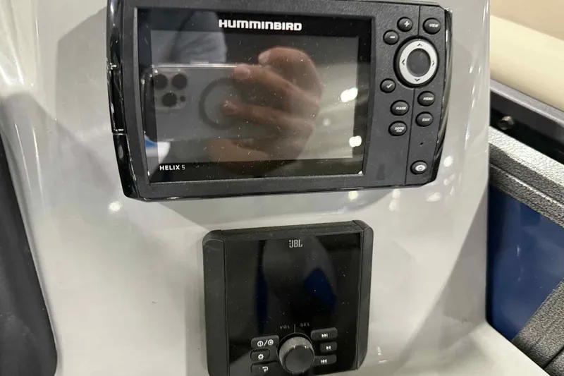 Slide: The Image of Control panel of 2026 Bentley Pontoons Legacy 223 Navigator with Humminbird and JBL systems. - 9