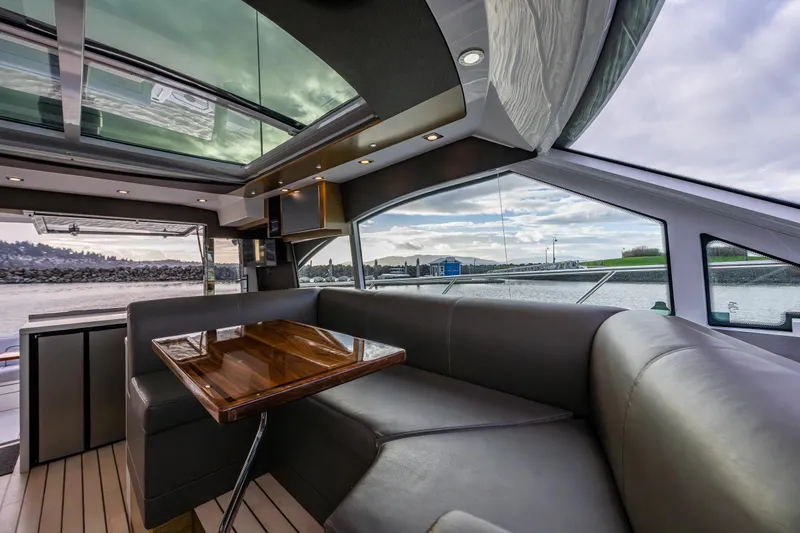 Slide: The Image of Luxurious interior of 2014 Cruisers Yachts 45 Cantius with panoramic windows and elegant seating. - 25