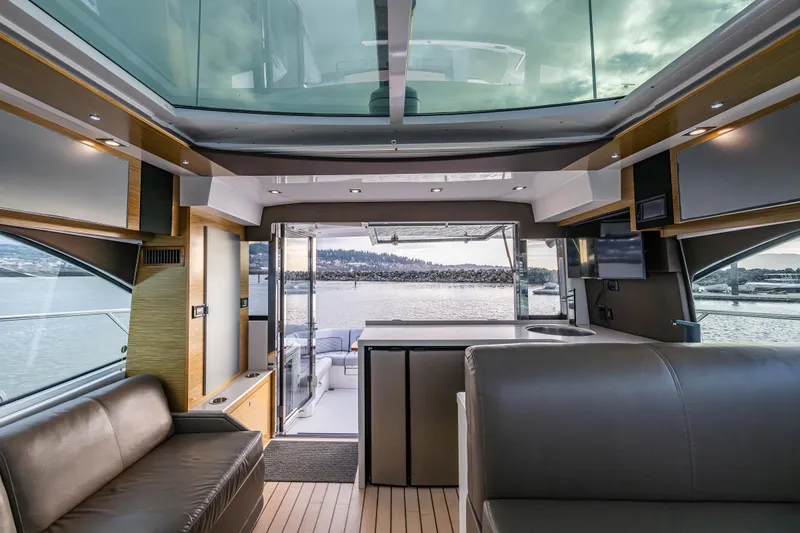 Slide: The Image of Luxurious interior of 2014 Cruisers Yachts 45 Cantius with panoramic windows and modern design. - 26