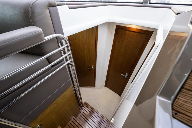 Slide: The Image of Interior view of 2014 Cruisers Yachts 45 Cantius, featuring wooden doors and modern design. - 32