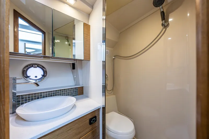 Slide: The Image of Luxurious bathroom in 2014 Cruisers Yachts 45 Cantius with modern fixtures and shower. - 33