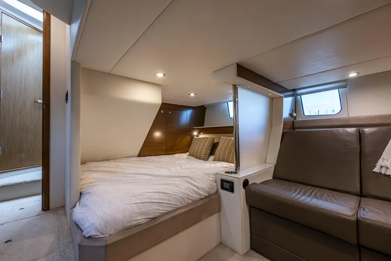 Slide: The Image of Luxurious interior of 2014 Cruisers Yachts 45 Cantius with cozy bed and seating area. - 35