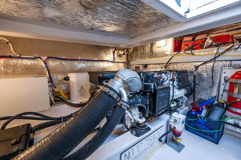 Slide: The Image of Engine room of 2014 Cruisers Yachts 45 Cantius with visible machinery and equipment. - 44