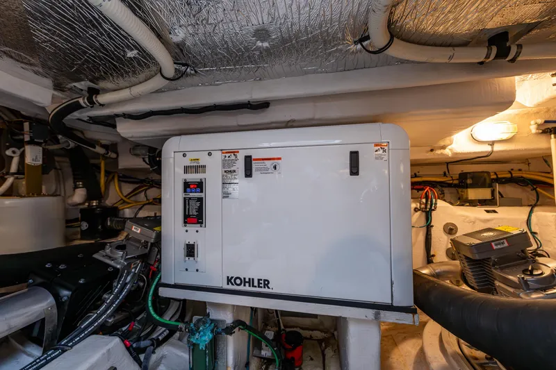 Slide: The Image of Engine room of 2014 Cruisers Yachts 45 Cantius with Kohler generator and wiring. - 46