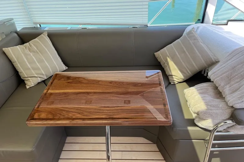 Slide: The Image of Luxurious interior of 2014 Cruisers Yachts 45 Cantius with elegant seating and wooden table. - 6