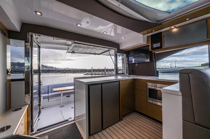 Slide: The Image of Luxurious interior of 2014 Cruisers Yachts 45 Cantius with modern kitchen and scenic view. - 20