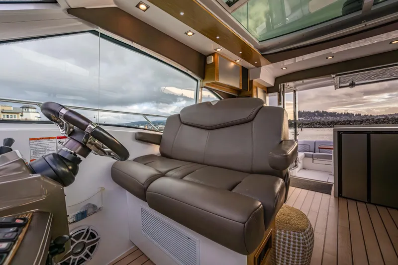 Slide: The Image of Interior of 2014 Cruisers Yachts 45 Cantius with luxurious seating and scenic view. - 24