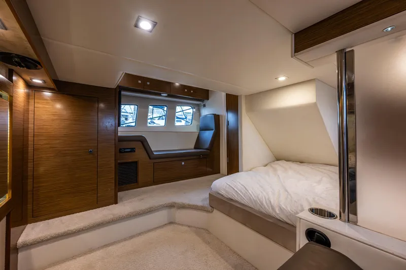 Slide: The Image of Luxurious interior of 2014 Cruisers Yachts 45 Cantius with modern wood finishes and cozy bedding. - 36