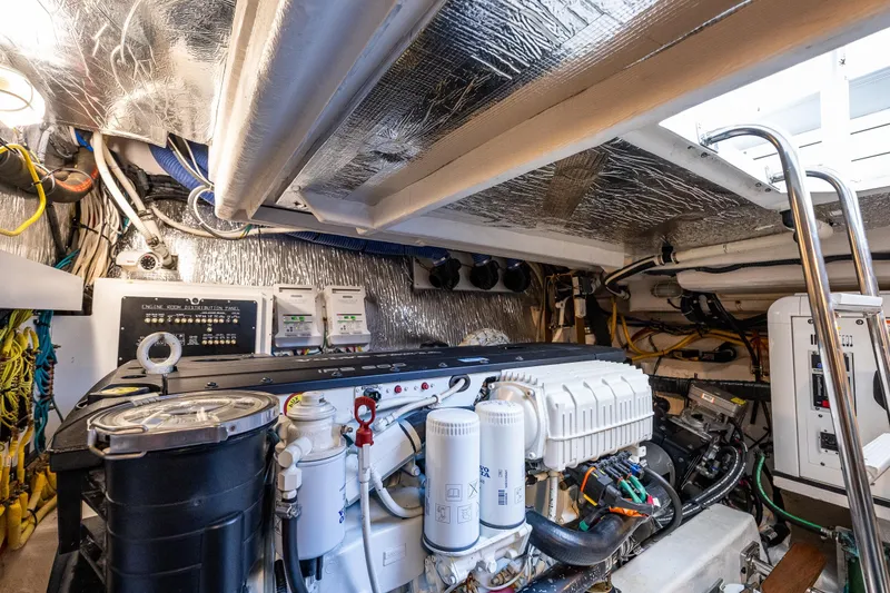 Slide: The Image of Engine room of 2014 Cruisers Yachts 45 Cantius, showcasing mechanical components and wiring. - 40