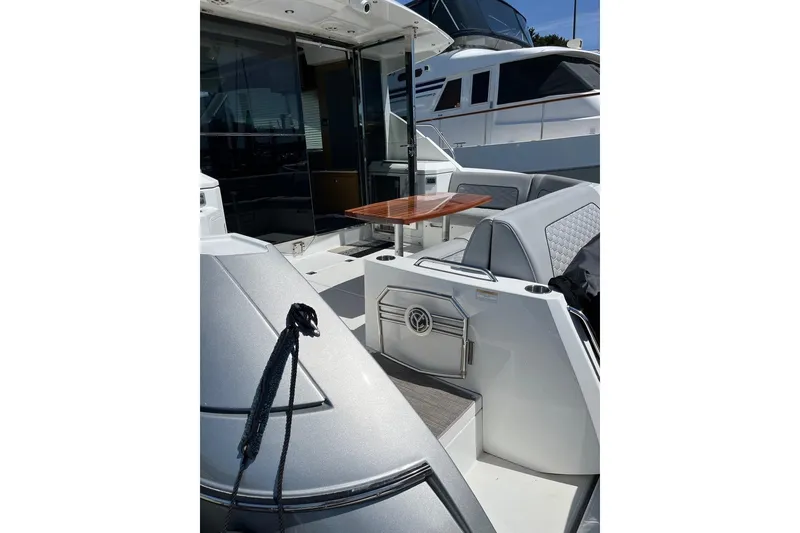 Slide: The Image of 2014 Cruisers Yachts 45 Cantius with sleek deck and modern seating area. - 5