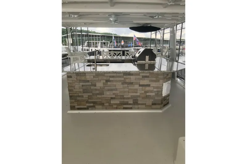 Slide: The Image of Outdoor kitchen on 2023 Sumerset 18 x 81 houseboat with stone bar and grill. - 15