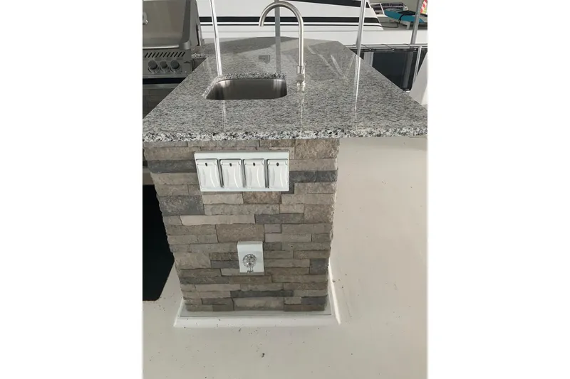 Slide: The Image of Granite countertop with sink on Sumerset 18 x 81 houseboat, 2023 model. - 19