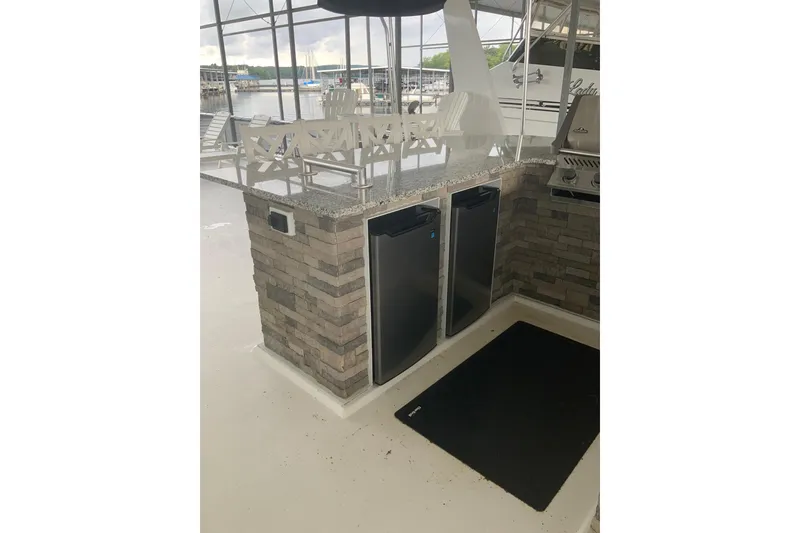 Slide: The Image of Outdoor kitchen on 2023 Sumerset 18 x 81 houseboat with granite countertop and stainless appliances. - 20