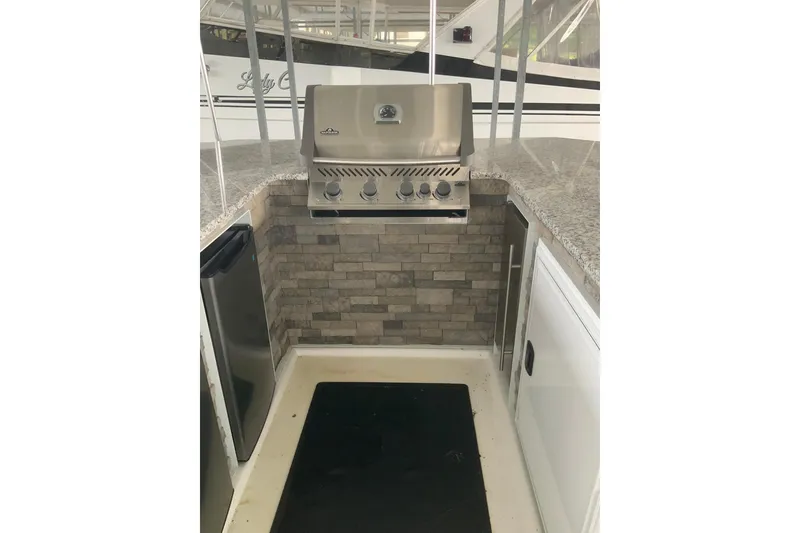Slide: The Image of Outdoor kitchen with stainless steel grill on 2023 Sumerset 18 x 81 houseboat. - 21