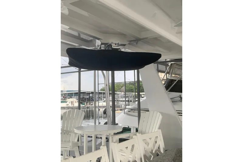 Slide: The Image of Outdoor seating area on 2023 Sumerset 18 x 81 houseboat with marina view. - 24