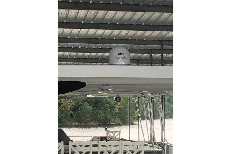 Slide: The Image of 2023 Sumerset 18 x 81 houseboat with satellite dish under a metal roof. - 29