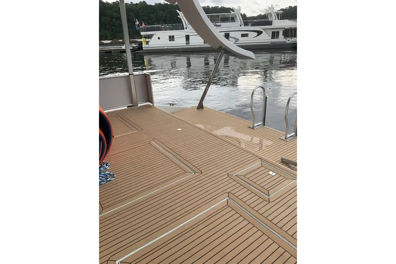 Slide: The Image of Modern Sumerset 18 x 81 houseboat deck with sleek design, docked on calm water. - 35