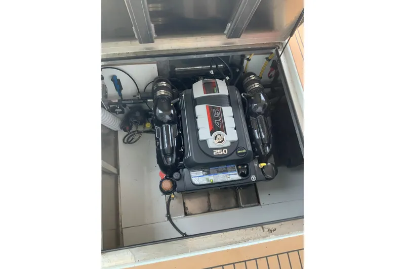 Slide: The Image of Engine compartment of 2023 Sumerset 18 x 81 houseboat, featuring a 250 horsepower engine. - 38