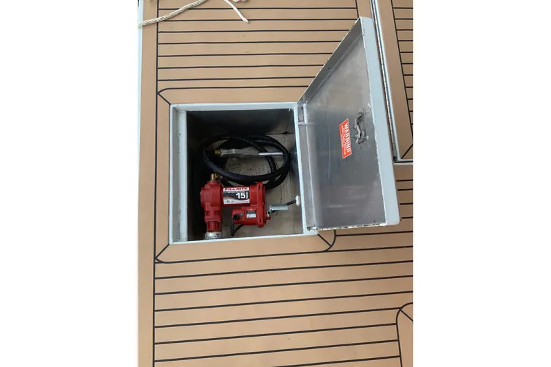 Slide: The Image of Open hatch on Sumerset 18 x 81 houseboat deck, revealing equipment inside. - 39