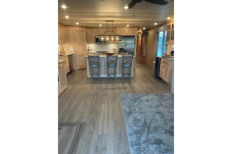 Slide: The Image of Modern kitchen interior in 2023 Sumerset 18 x 81 houseboat, featuring sleek design and ample lighting. - 41