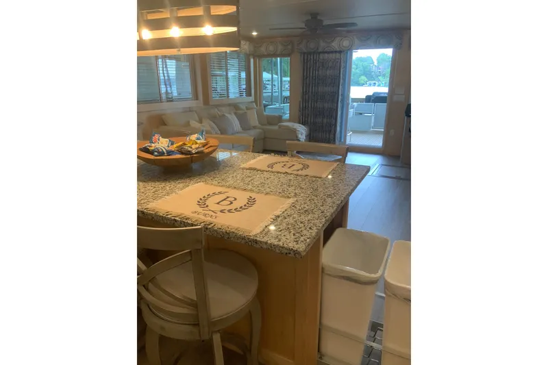 Slide: The Image of Interior of 2023 Sumerset 18 x 81 houseboat with modern kitchen and cozy seating area. - 52