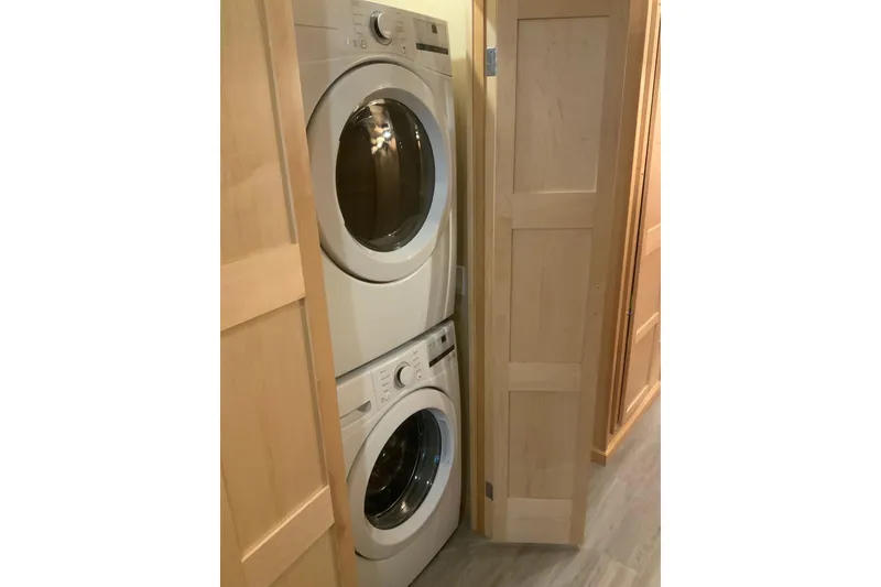 Slide: The Image of Stacked washer and dryer in Sumerset 18 x 81 houseboat, 2023 model. - 58
