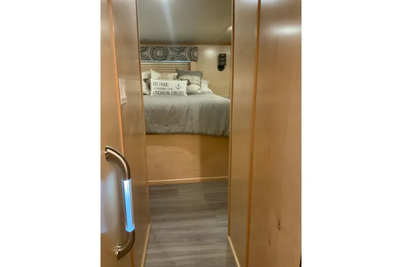 Slide: The Image of Interior of 2023 Sumerset 18 x 81 houseboat bedroom with cozy decor and wooden finish. - 59