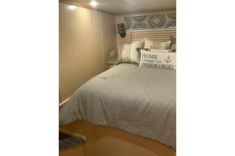 Slide: The Image of Cozy bedroom in 2023 Sumerset 18 x 81 houseboat with nautical-themed decor. - 60