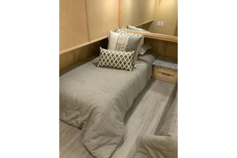 Slide: The Image of Cozy bedroom in 2023 Sumerset 18 x 81 houseboat with modern decor and plush bedding. - 68