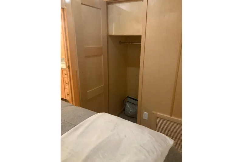 Slide: The Image of Wooden closet interior in 2023 Sumerset 18 x 81 houseboat bedroom. - 74