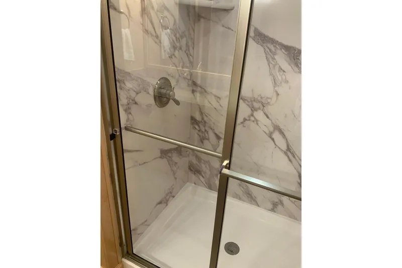 Slide: The Image of Luxurious marble shower in 2023 Sumerset 18 x 81 houseboat bathroom. - 81