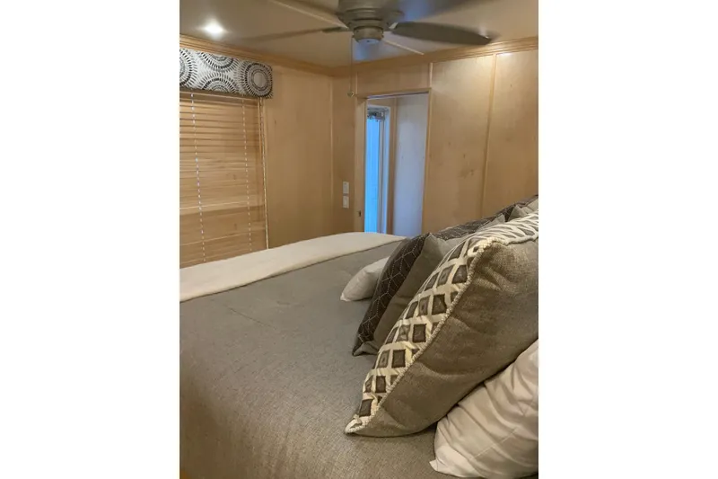 Slide: The Image of Cozy bedroom interior in 2023 Sumerset 18 x 81 houseboat with elegant decor. - 82